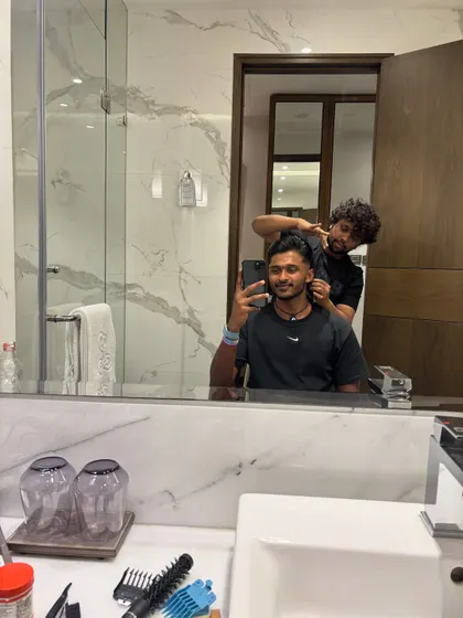In the middle of a session with Sai Sudharsan, ensuring every detail is perfect.