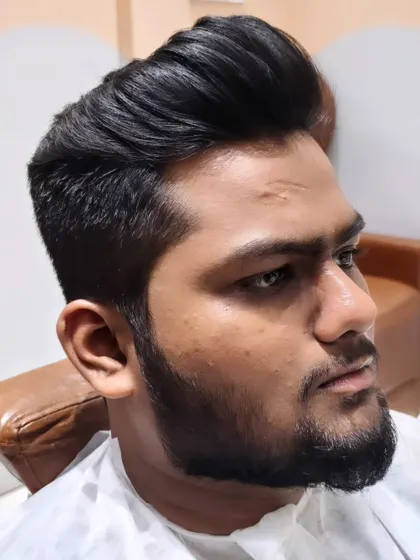 Cut, trimmed, combed, and styled to perfection. A great haircut and beard for a strong, masculine look.