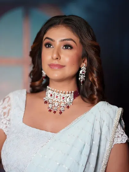 The swan-motif earrings and choker add a unique and graceful touch to this modern ensemble.