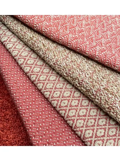 The 'Zen Upholstery' collection in rich, warm hues of red. The combination of beautiful geometric patterns and high durability makes these fabrics a winning choice for stylish, long-lasting furniture.