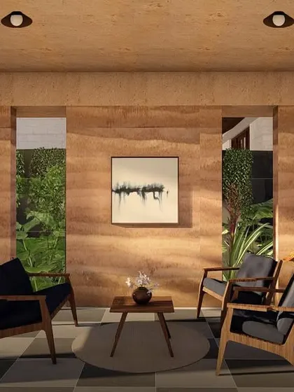 We believe in the beauty of natural materials. This sitting area in one of our Morjim villas showcases the rich texture and color of a rammed earth wall. This ancient technique not only creates stunning, layered surfaces but also helps passively cool the home, making it comfortable and energy efficient.