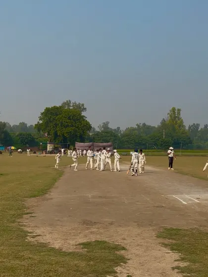 The team celebrating their narrow victory.