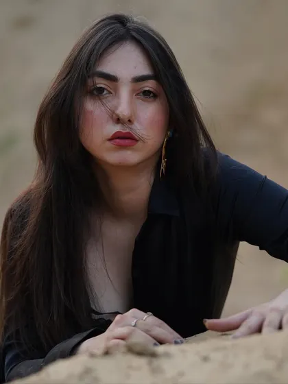 A powerful, direct gaze into the camera. This raw, unedited portrait is all about confidence and vulnerability.