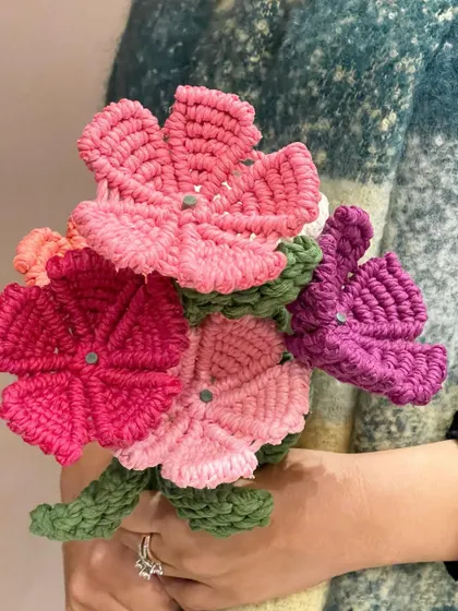 A close-up of the macrame flower bouquet, showing the detail in each petal. These make a wonderful, long-lasting gift for Valentine's Day, birthdays, or any occasion.