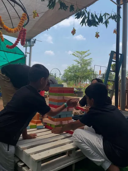 Kids enjoying a game of giant Jenga at the Mango Festival. My events are designed to be family-friendly, with plenty of games and activities to keep everyone entertained.