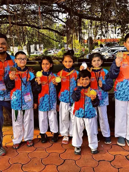 Our team in their official jackets, united and proud after their performance at the International Taekwondo Championship.