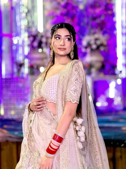 A closer look at the beautiful ivory lehenga we provided for a last-minute request. The delicate embroidery and flattering silhouette made it a perfect choice.