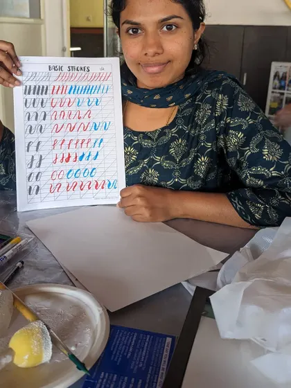 A participant practicing her calligraphy. Our workshops are great for learning the fundamentals of this beautiful art form.