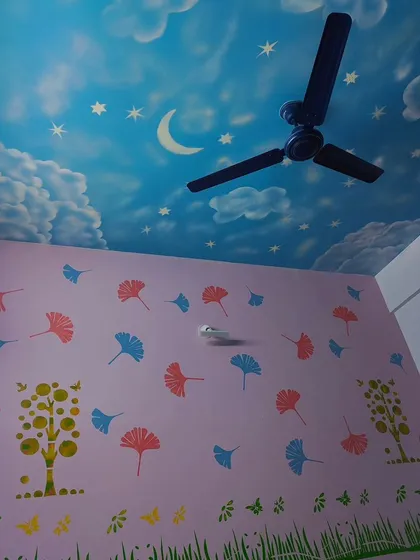 A complete look at this whimsical kids' room. The sky ceiling is complemented by a lavender wall with colorful falling leaves and tree stencils, creating a full nature theme.