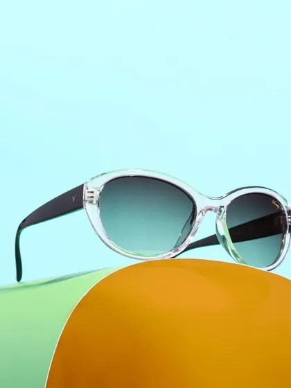 A vibrant shot of clear-framed sunglasses against a colorful, layered background. The use of bright colors and curved shapes makes the product feel modern and fun.