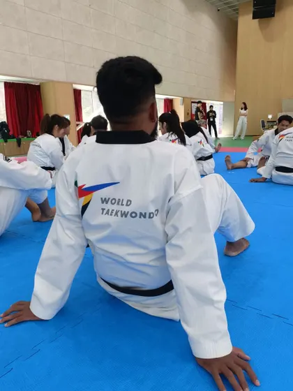 The back of my dobok, showing my affiliation with World Taekwondo during a training session.