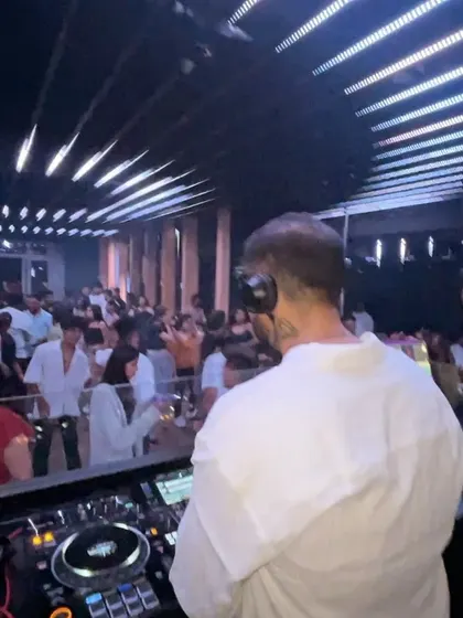 A view from behind, showing my perspective of the packed club. I'm always reading the crowd to decide the next move.