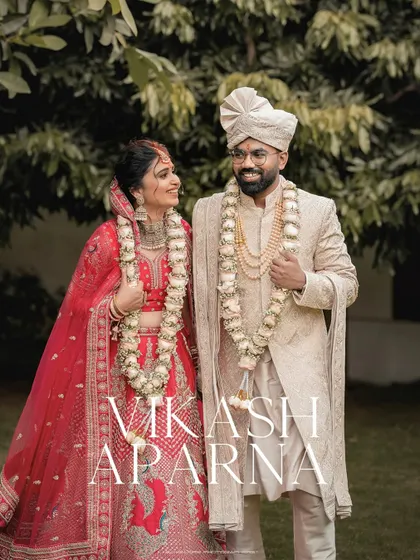 A classic wedding portrait with the bride and groom looking at each other with love. The names "Vikash" and "Aparna" add a personal touch to this memory.