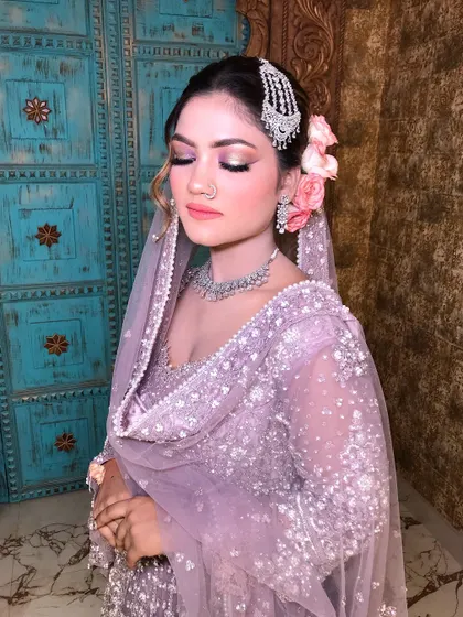 Eyes closed, you can see the delicate shimmer and the perfect blend of the eyeshadow, creating a soft, romantic feel.