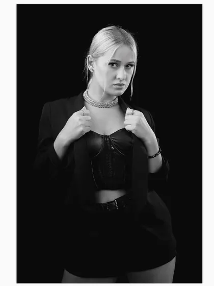 Another strong pose from the same monochrome series. The model's confident stance and the clean composition make this a powerful addition to any portfolio.