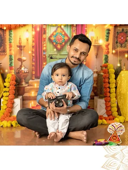 A father and son moment during our Diwali shoot. The little one holds a camera, perhaps a future photographer just like me.