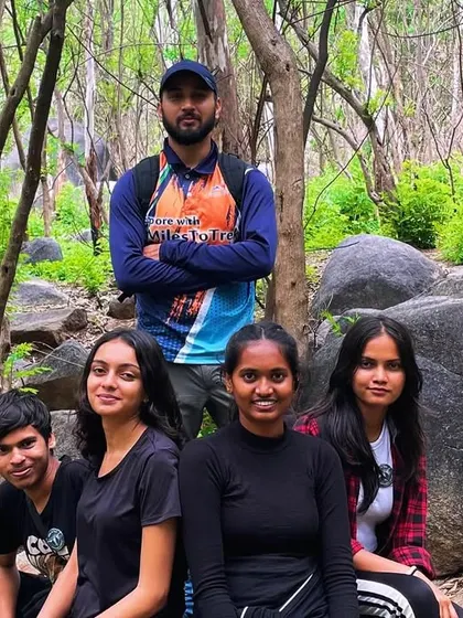 A small group posing in the forest during the Anthargange trek. The trail takes you through beautiful, dense woods.
