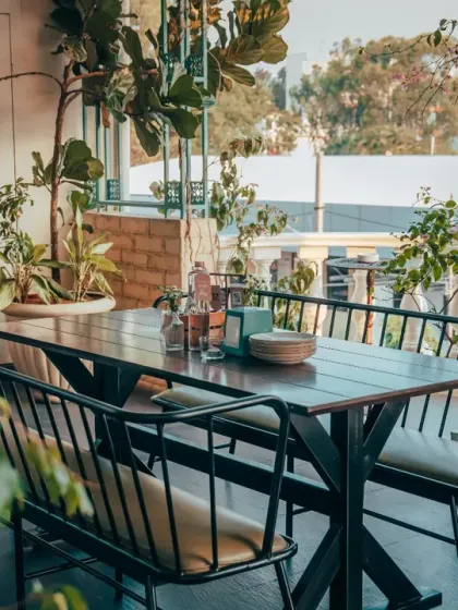 One of my favorite spots is this outdoor patio. It’s a space to enjoy Bangalore's pleasant weather, surrounded by greenery, making it a refreshing setting for casual get-togethers or a breakout area during corporate events.
