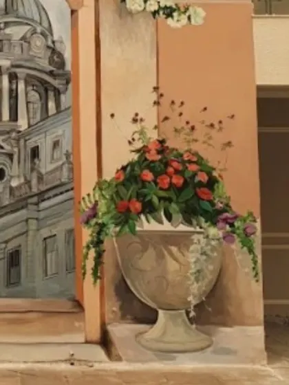 A detailed shot of the flower-filled urn from the Spanish mural, showcasing the rich colors and realistic textures.