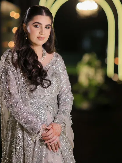 A portrait of the bride-to-be in her elegant half-up hairstyle.