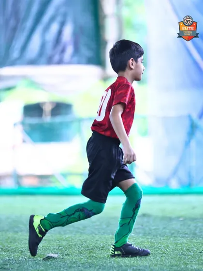 Always ready, always moving. A young athlete maintains proper form while running during a drill, building the stamina required for a full 90-minute game.