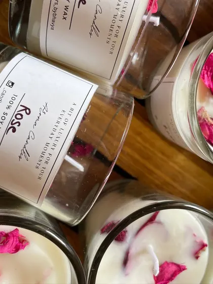 A close-up of the rose-scented votive candles, with real rose petals sprinkled on top.