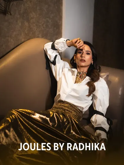 Aneri Vajani relaxing in a stylish pose, proving that my couture jewelry can be worn to make a statement in any setting.