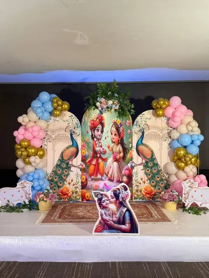For a traditional and blessed celebration, we created this beautiful Krishna-themed backdrop. The design incorporates divine imagery, peacock motifs, and arches of pastel and gold balloons, perfect for a baby welcome or Janmashtami event.