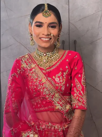 A close-up showcasing the detailed jewellery and the complementary makeup, with warm tones on the eyes and a perfectly matched lip colour.