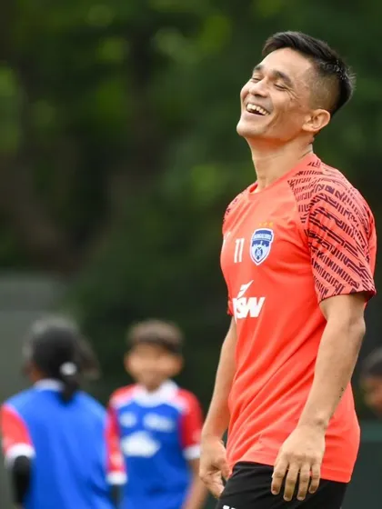 The captain shares a laugh on the pitch. These events create unforgettable memories for our young players.