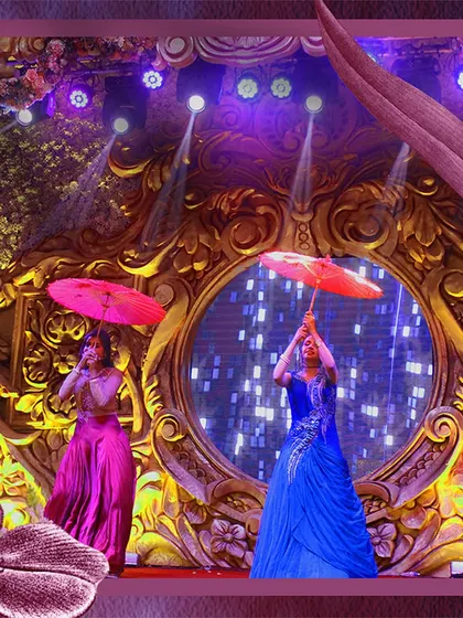 We use props and colorful costumes to bring performances to life. This dance number featuring parasols was choreographed by us to add a touch of whimsy and visual flair to the Sangeet night.