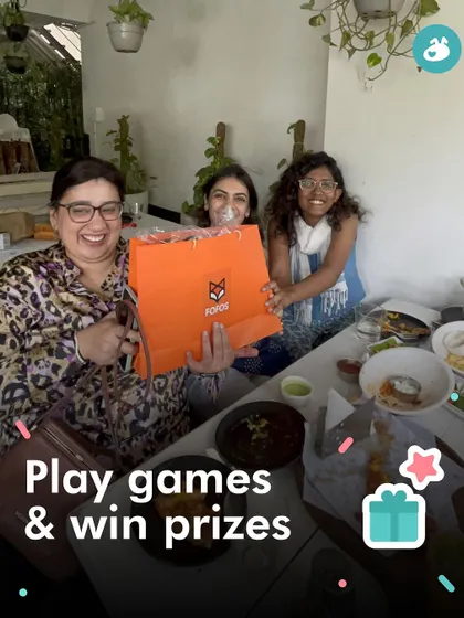 A happy winner receives her prize. We always include fun games and giveaways to make our Addas more exciting.