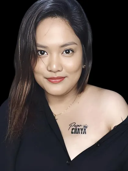 A "Pyaar" and "Chhaya" name tattoo on the collarbone, designed with a crown.