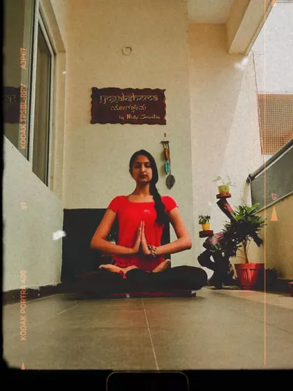 The Namaskara Mudra in Padmasana (Lotus Pose). This simple gesture of bringing the palms together at the heart center is a way to greet, show respect, and center yourself before starting your practice.