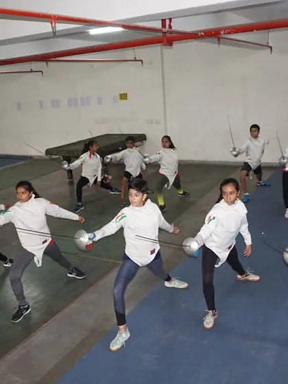 A wide view of our girls team practicing their lunges. This drill is crucial for developing the power and reach needed for a successful attack in Foil, Epee, and Sabre.