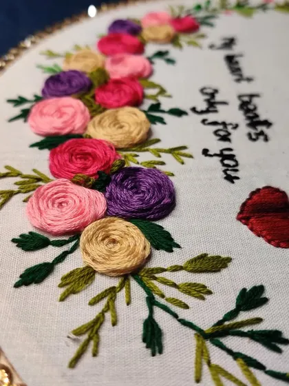 Another angle of the custom quote embroidery, showing the sequin border.