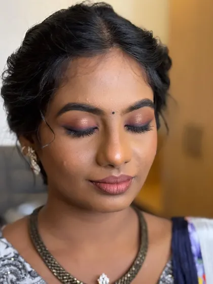 A close-up of Deekshida's engagement look. The mauve and berry-toned smokey eye is sultry and stunning, perfect for an evening event.