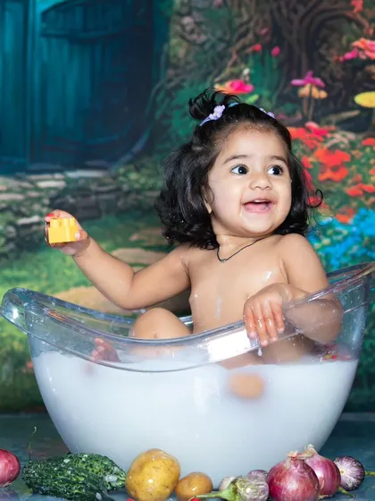 A unique twist on the bath shoot, with this little one surrounded by fresh vegetables.