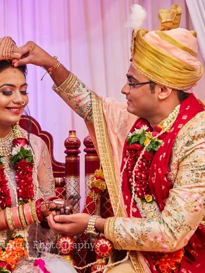 The Sindoor Daan is one of the most significant rituals. I capture this moment with a focus on the couple's expressions and the symbolic act.