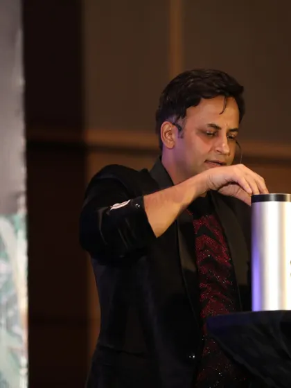 A close-up of a classic sleight-of-hand routine performed at the Balrampur Chini Mills event. Even in a large stage show, these intimate moments of magic are powerful.