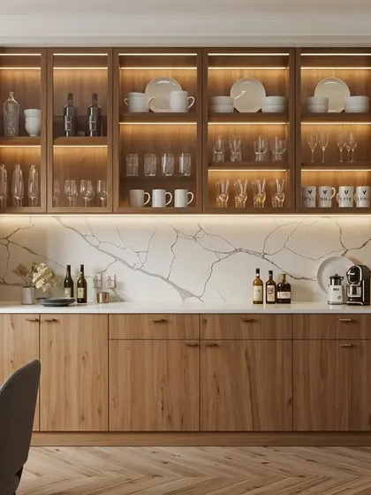 A beautiful all-wood crockery unit with glass-front upper cabinets and integrated lighting. The marble backsplash adds a touch of modern luxury.
