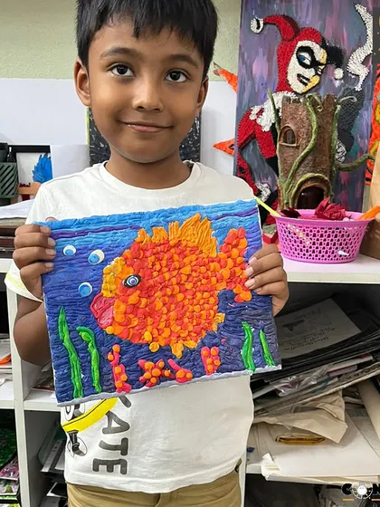 This detailed fish was made by rolling tiny balls of playdough. It's an incredibly effective activity for building finger strength and dexterity, essential skills for handwriting and other daily tasks.