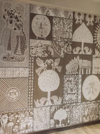 A wider shot of the folk art wallpaper, showing how it covers the entire wall and becomes the main feature of the room.