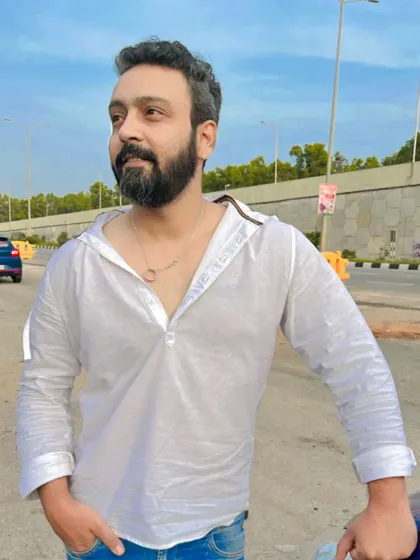 A casual, relaxed pose on the side of the road.