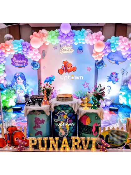An enchanting underwater theme with Finding Nemo characters for a first birthday.