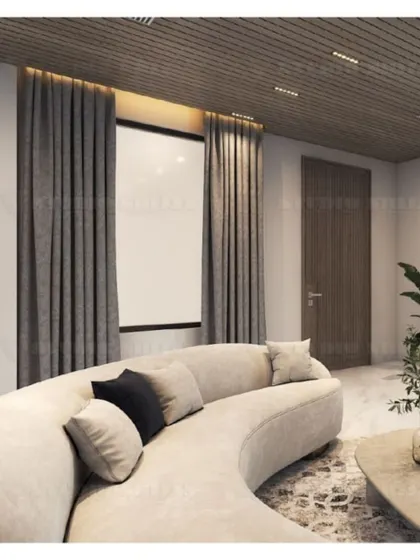 A comfortable, curved sofa in the Mansarovar Garden lobby, perfect for conversation and relaxation.