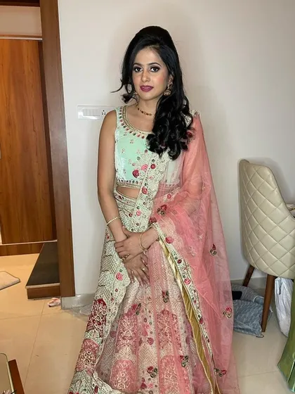 A closer look at the intricate floral embroidery and beadwork on the bodice of our mint and peach lehenga. We ensure every piece in our collection is well-maintained and ready for its close-up.