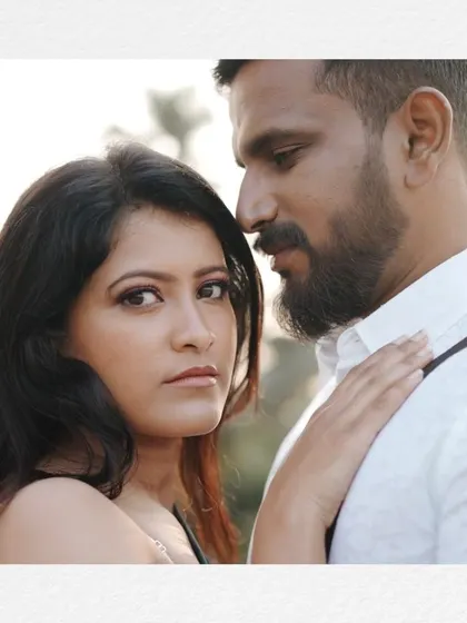 A close-up, intimate portrait of a couple, framed to create a cinematic, personal feel. We focus on capturing the deep connection between partners.