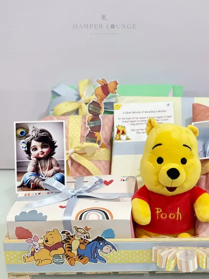A closer look at the personalized details in the Winnie the Pooh mom-to-be hamper. It includes a sweet photo of baby Krishna and other personal touches that make the gift a cherished keepsake for the new parents.