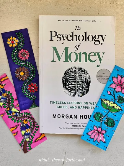 My hand-painted Madhubani bookmarks are perfect for any book lover. Here they are with a copy of "The Psychology of Money."